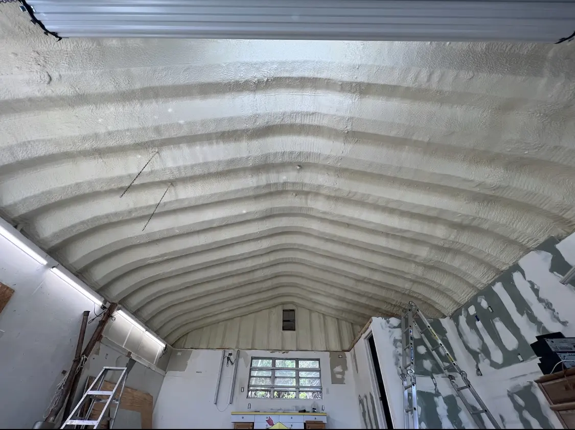 Spray polyurethane foam applied to the underside of a metal roof deck in Lisle
